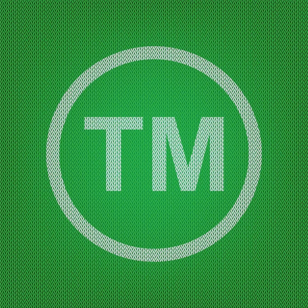 Sinal de marca. ícone branco no tricô verde ou coágulo de lã —  Vetores de Stock