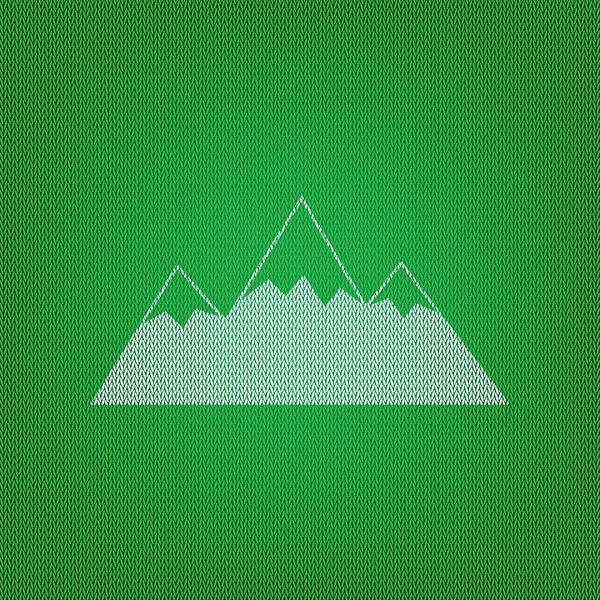 Signo de montaña ilustración. icono blanco en la prenda de punto verde o — Vector de stock