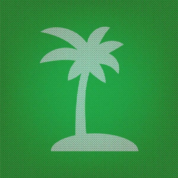 Знак кокосовой пальмы. белый значок на зеленом трикотаже или шерсти — стоковый вектор