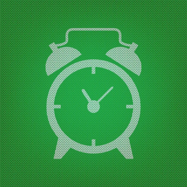 Alarm clock sign. white icon on the green knitwear or woolen clo — Stock Vector