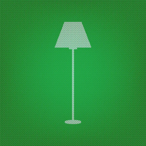 Простой знак лампы. белая иконка на зеленом трикотаже или шерстяном платье — стоковый вектор