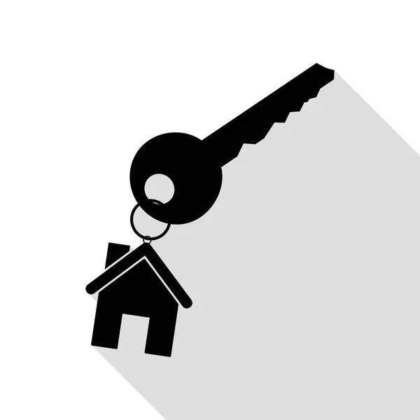 Ключ с брелоком в качестве знака дома. Черная иконка с плоской тенью . — стоковый вектор