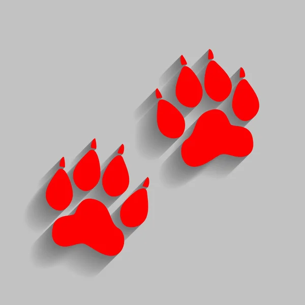 Signo de huellas de animales. Vector. Icono rojo con sombra suave sobre fondo gris . — Vector de stock