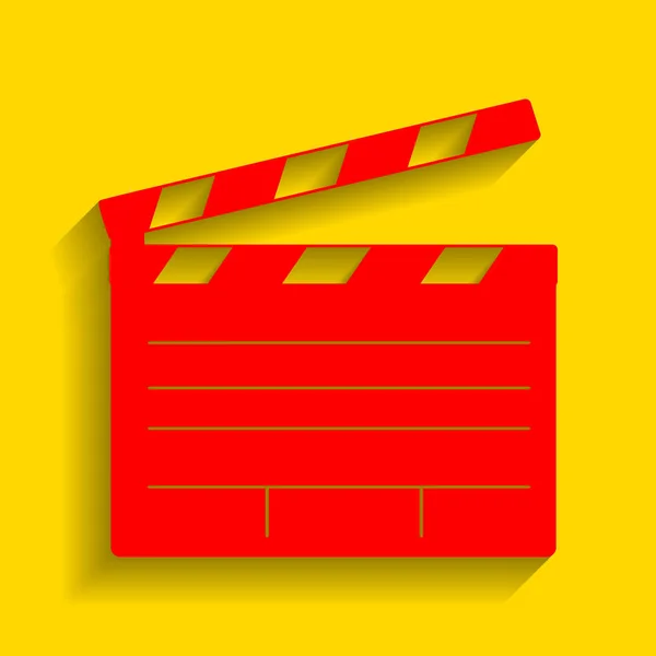 Filmklapptafel-Kinoschild. Vektor. rotes Symbol mit weichem Schatten auf goldenem Hintergrund. — Stockvektor