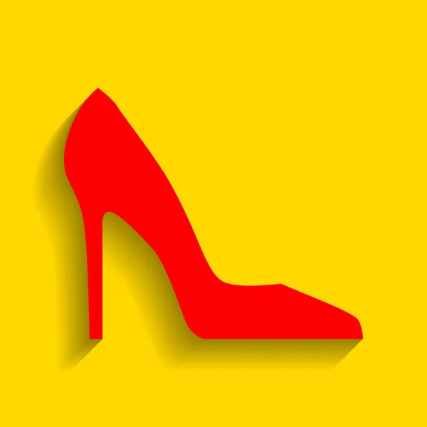 Um sapato de mulher. Vector. Ícone vermelho com sombra suave no fundo dourado . — Vetor de Stock