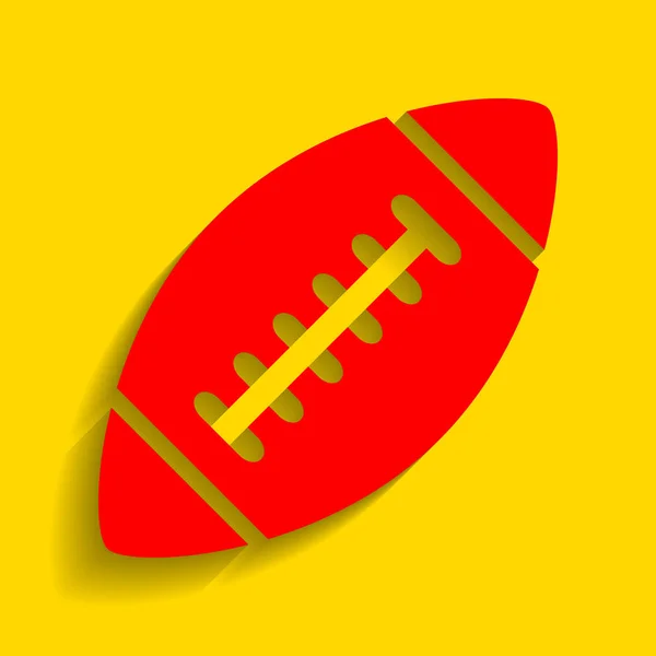 Pelota de fútbol americano simple. Vector. Icono rojo con sombra suave sobre fondo dorado . — Vector de stock