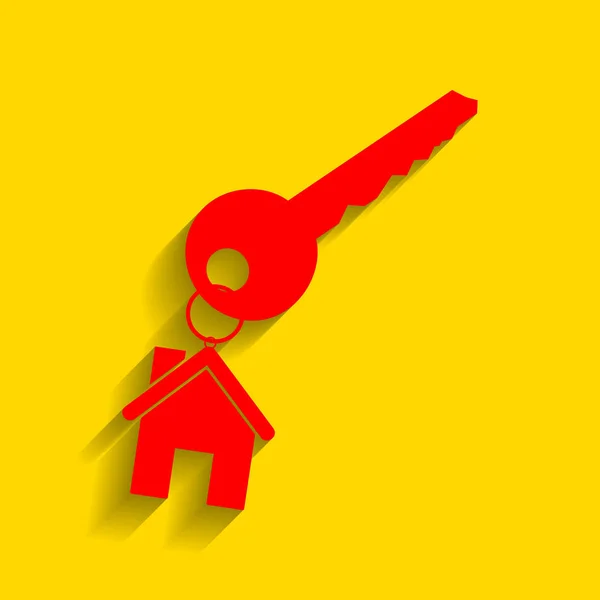 Κλειδί με keychain, ως ένα σύμβολο σπίτι. Διάνυσμα. Κόκκινο εικονίδιο με απαλή σκιά σε χρυσό φόντο. — Διανυσματικό Αρχείο