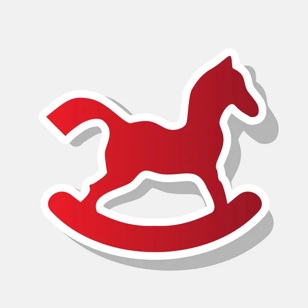 Знак лошадиной игрушки. Вектор. Новогодняя красноватая икона с внешним штрихом и тенью на светлом фоне . — стоковый вектор