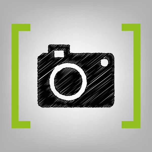 Digital camera sign. Vector. Black scribble icon in citron brackets on grayish background. — Stock Vector