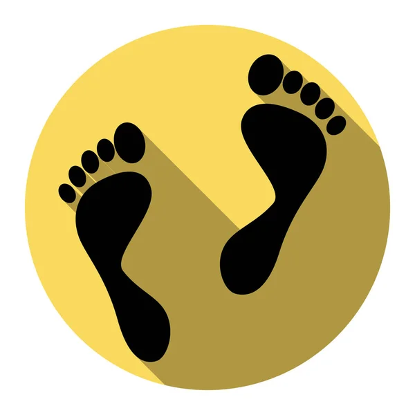 Знак отпечатков ног. Вектор. Плоская черная икона с плоской тенью на королевском желтом круге с белым фоном. Isolated . — стоковый вектор
