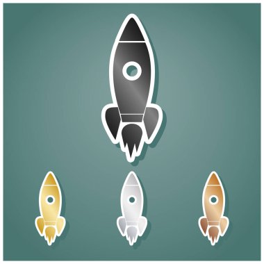 Roket işareti çizimi. Gri, altın, gümüş ve bronz renkli metalik simgeler seti. Beyaz çizgili ve Viridan arka planında gölgeli..