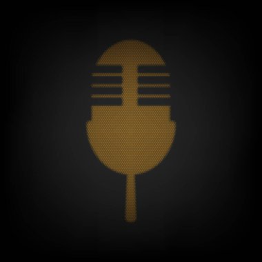 Retro mikrofon işareti. Karanlıktaki küçük turuncu ampulün ızgarası gibi simge.