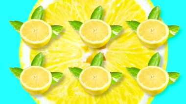Limonla animasyon yapıyorum. Yeşil yapraklı birkaç dilim limon büyük sarı bir narenciye diliminin arka planında döner..