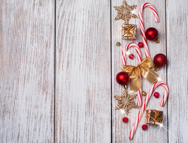 Christmas decorations - gift box, candy canes — Stock Photo, Image