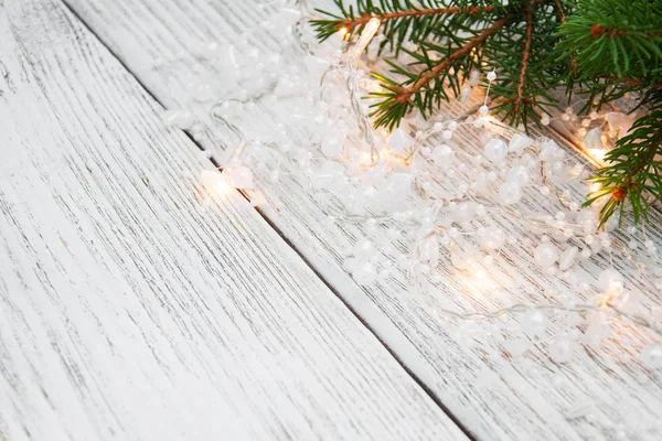 Christmas tree branch and lights — Stock Photo, Image