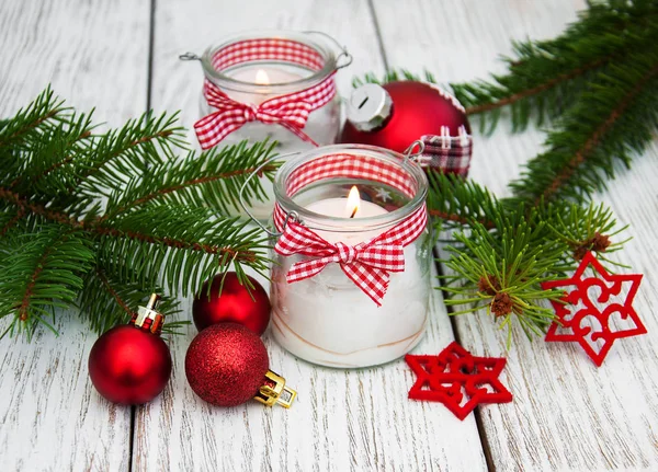 christmas decorations candles in glass jars with fir