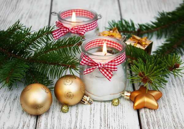 christmas decorations candles in glass jars with fir