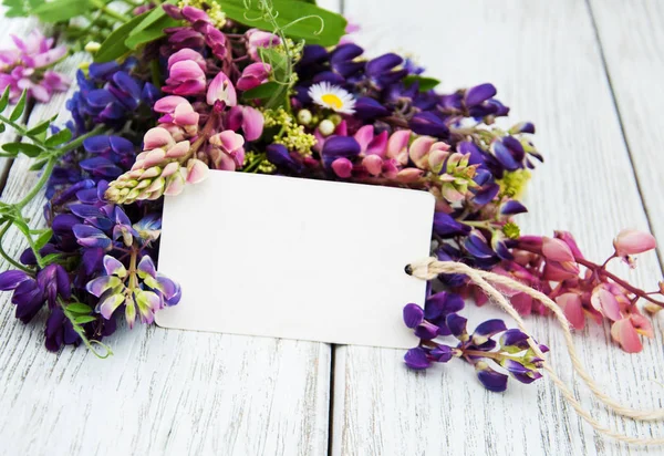 Lupine flowers on a  table — Stock Photo, Image