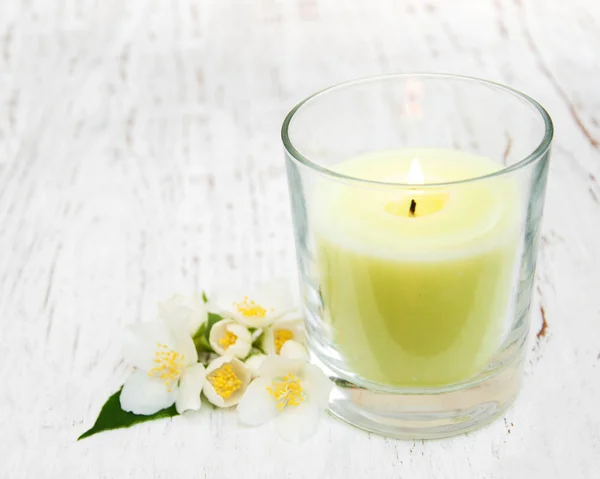 Candle with jasmine flowers — Stock Photo, Image