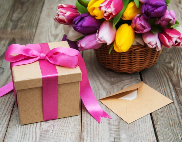 Spring tulips flowers and gift box Royalty Free Stock Images