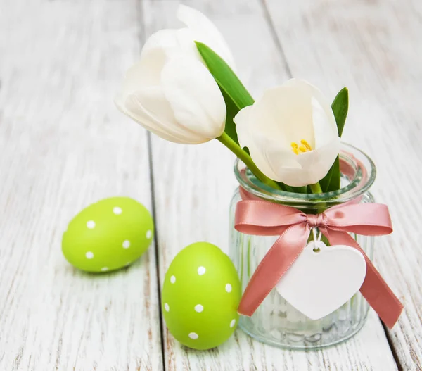 Easter eggs and tulips — Stock Photo, Image