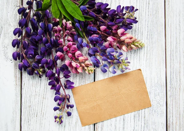 Lupine flowers on a  table — Stock Photo, Image