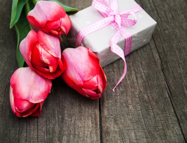 Spring tulips flowers and gift box