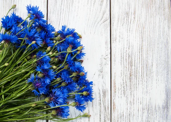 Blue cornflowers on a table — Stock Photo, Image