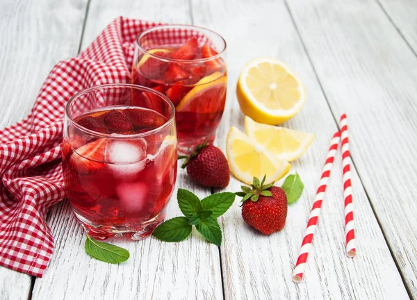 Glasses of lemonade with strawberries