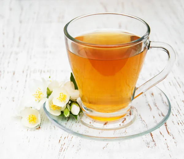 Cup of tea with jasmine flowers — Stock Photo, Image