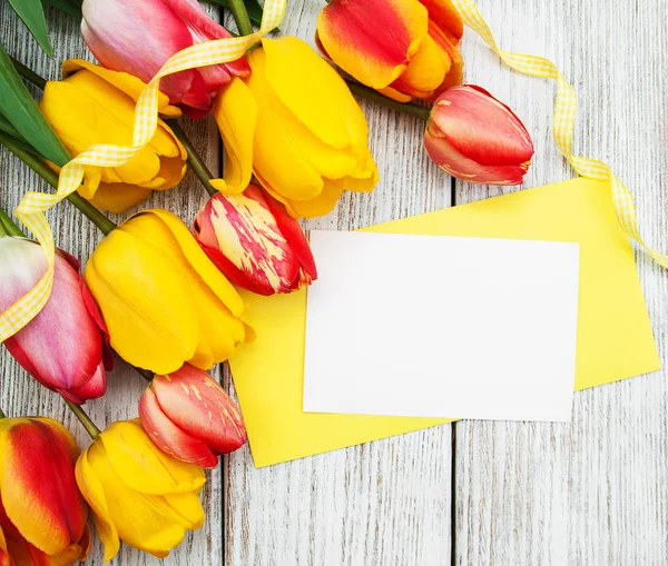 Spring tulips flowers and card — Stock Photo, Image