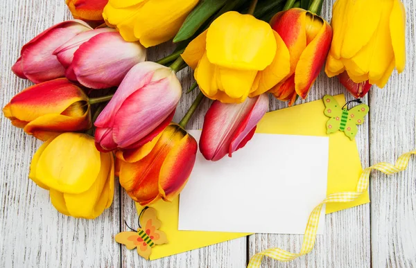 Spring tulips flowers and card — Stock Photo, Image