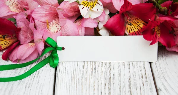 Paper card with alstroemeria flowers — Stock Photo, Image