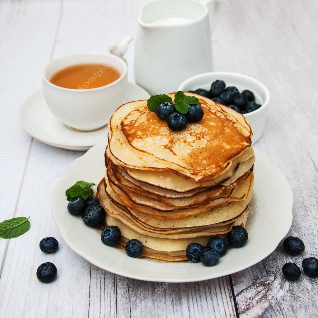 Plate with pancakes and blueberries