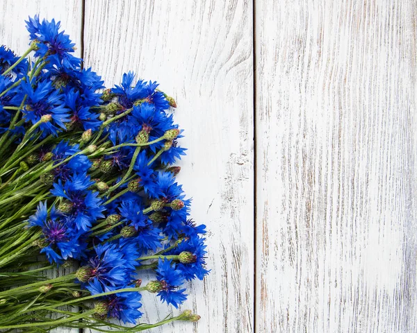 Blue cornflowers on a table — Stock Photo, Image