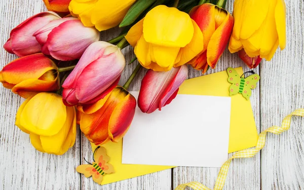 Spring tulips flowers and card — Stock Photo, Image