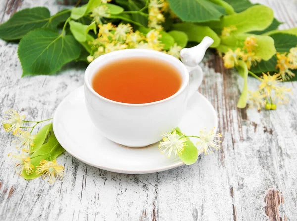 Cup of herbal tea with linden flowers — Stock Photo, Image