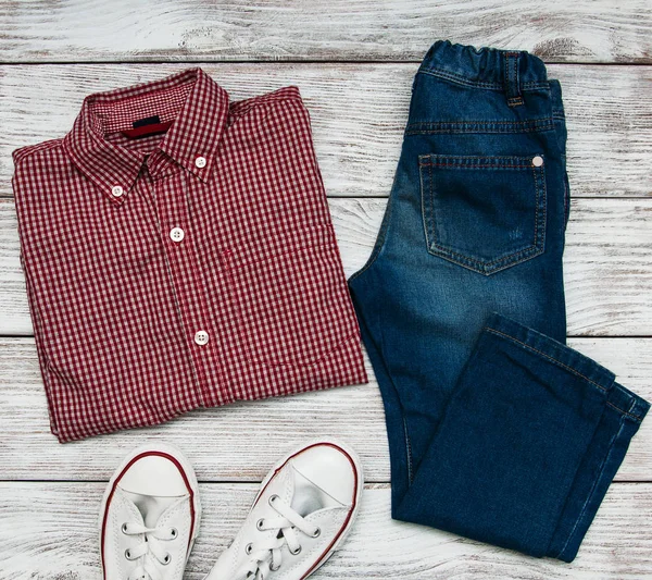 Checkered shirt and jeans