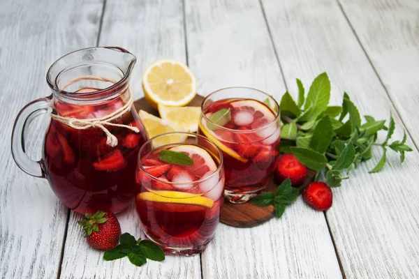 Glasses of lemonade with strawberries