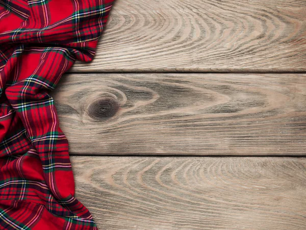 Checkered napkin on a wooden background — Stock Photo, Image