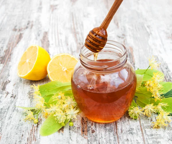 Honey and  linden flowers — Stock Photo, Image