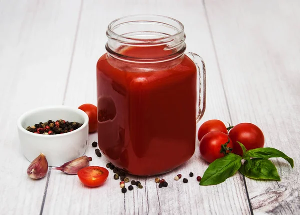 Jars with tomato juice — Stock Photo, Image