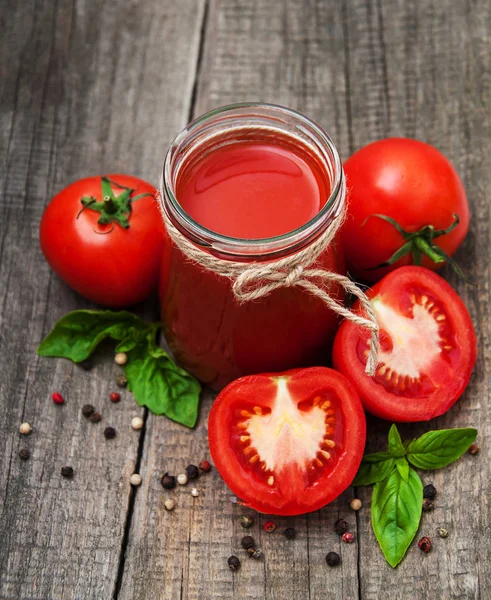 Jars with tomato juice — Stock Photo, Image