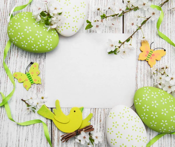 Easter eggs and greeting card — Stock Photo, Image