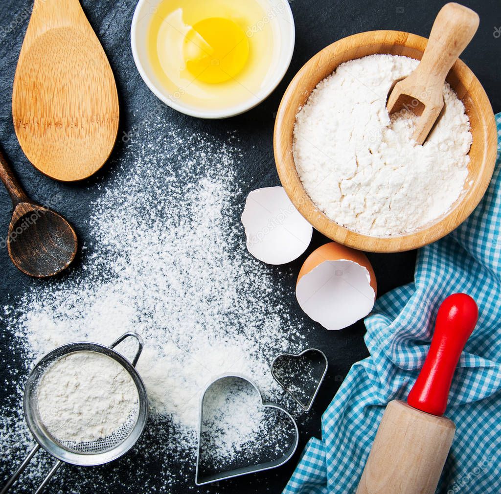 Baking ingredients on a black