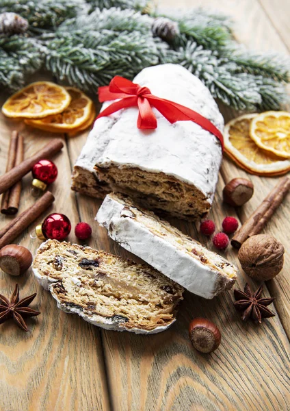 Christmas stollen on wooden background — Stock Photo, Image
