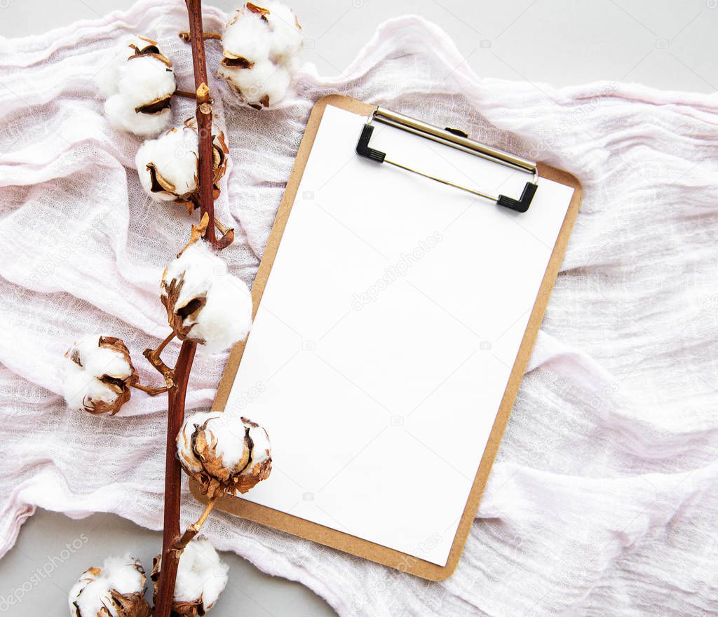 Clipboard and cotton flowers