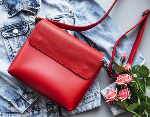 Red leather bag. Flat lay. Top view.