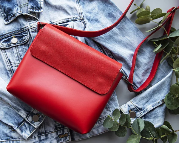 Red leather bag. Flat lay. Top view.