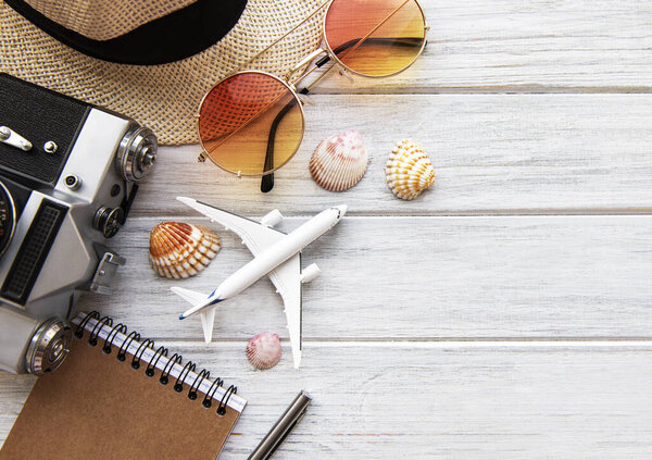 Summer holiday background, travel concept with camera on wooden table background. Flat lay